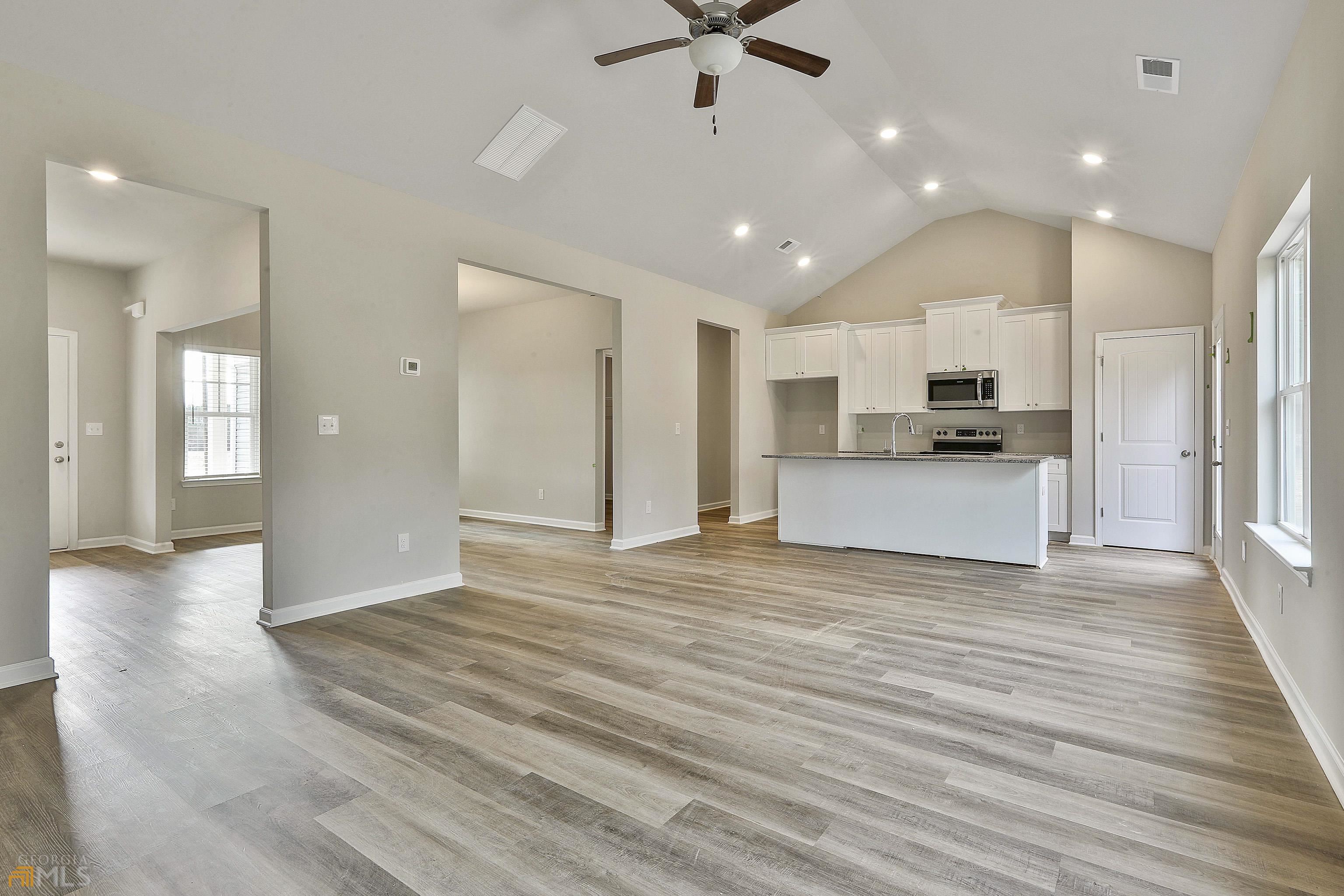 3575 Strickland Town Road Luthersville, GA 30251 - Photo 16 of 29 a view of a kitchen with a sink and a refrigerator