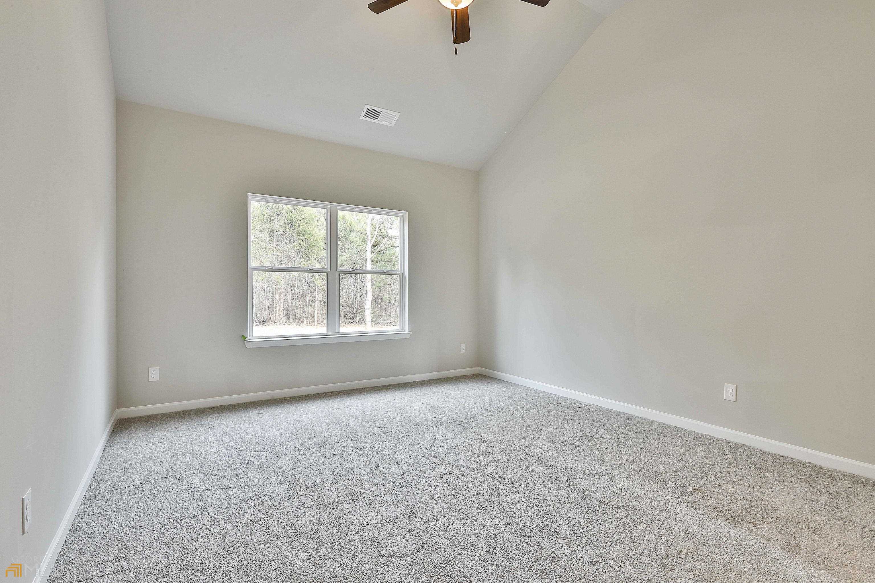 3575 Strickland Town Road Luthersville, GA 30251 - Photo 17 of 29 an empty room with a window