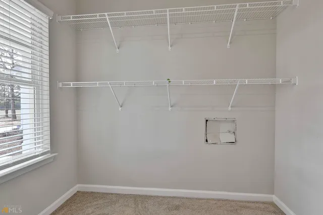 a view of a room with racks on the wall