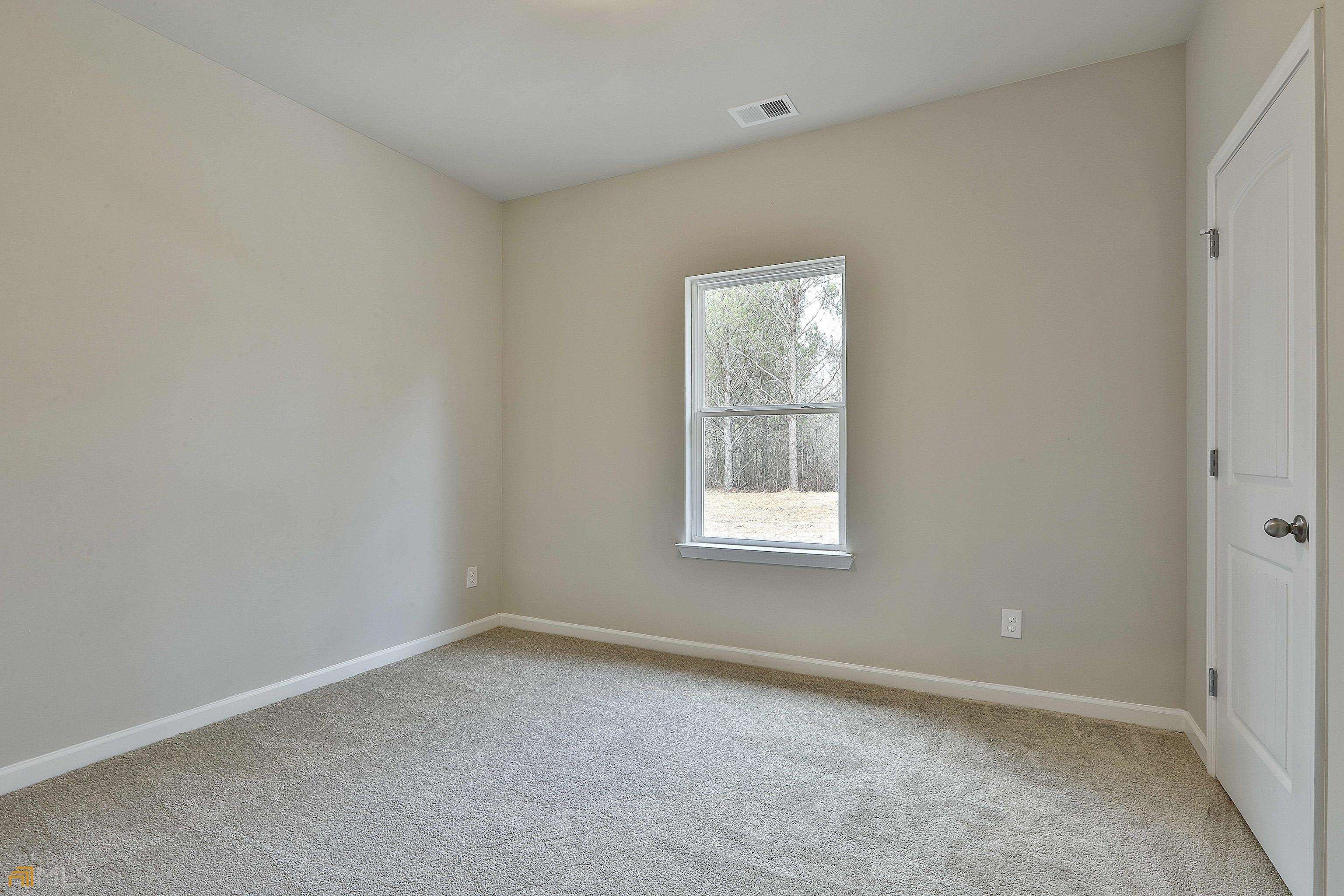 3575 Strickland Town Road Luthersville, GA 30251 - Photo 27 of 29 an empty room with a window