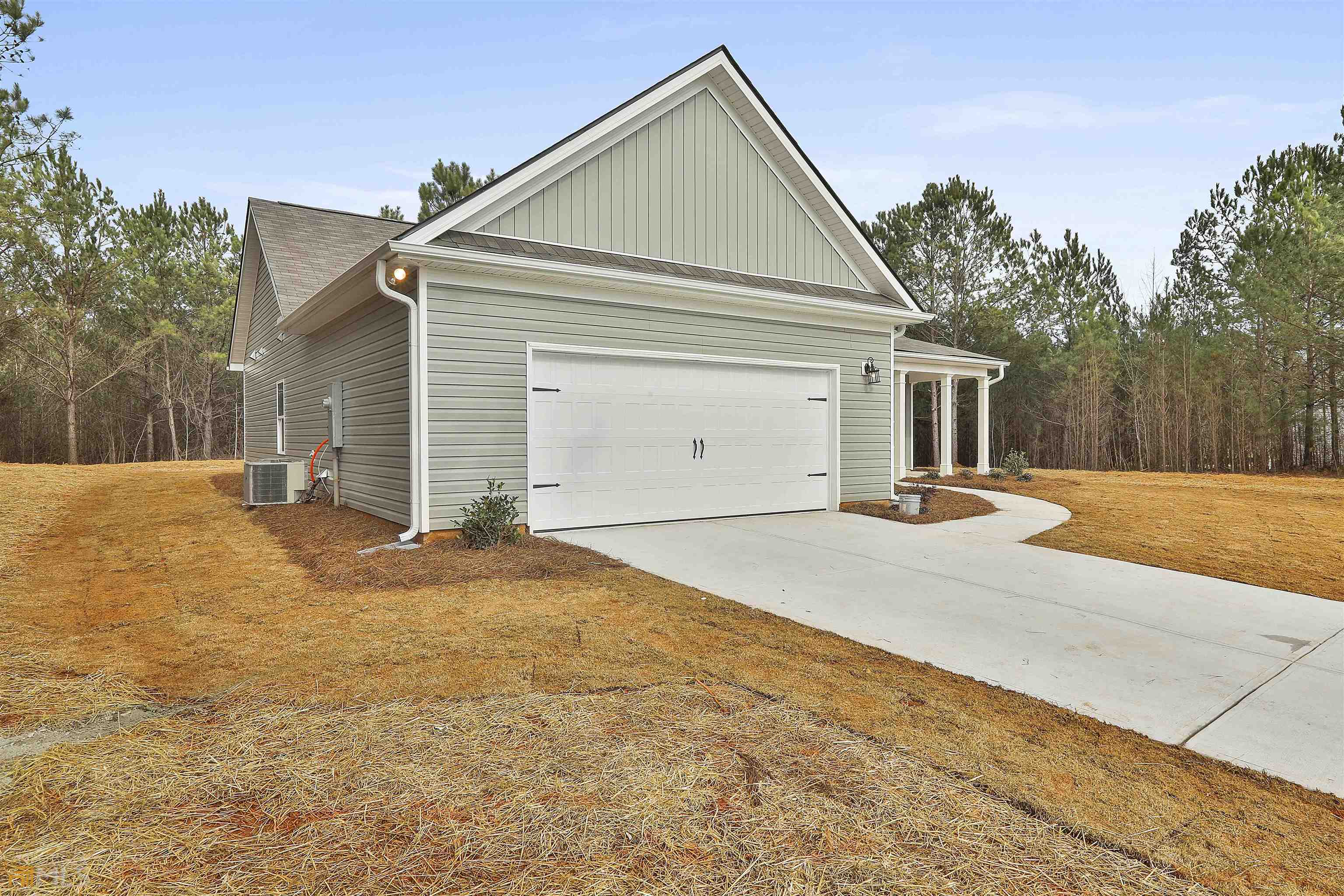 3575 Strickland Town Road Luthersville, GA 30251 - Photo 5 of 29 a front view of a house with a yard