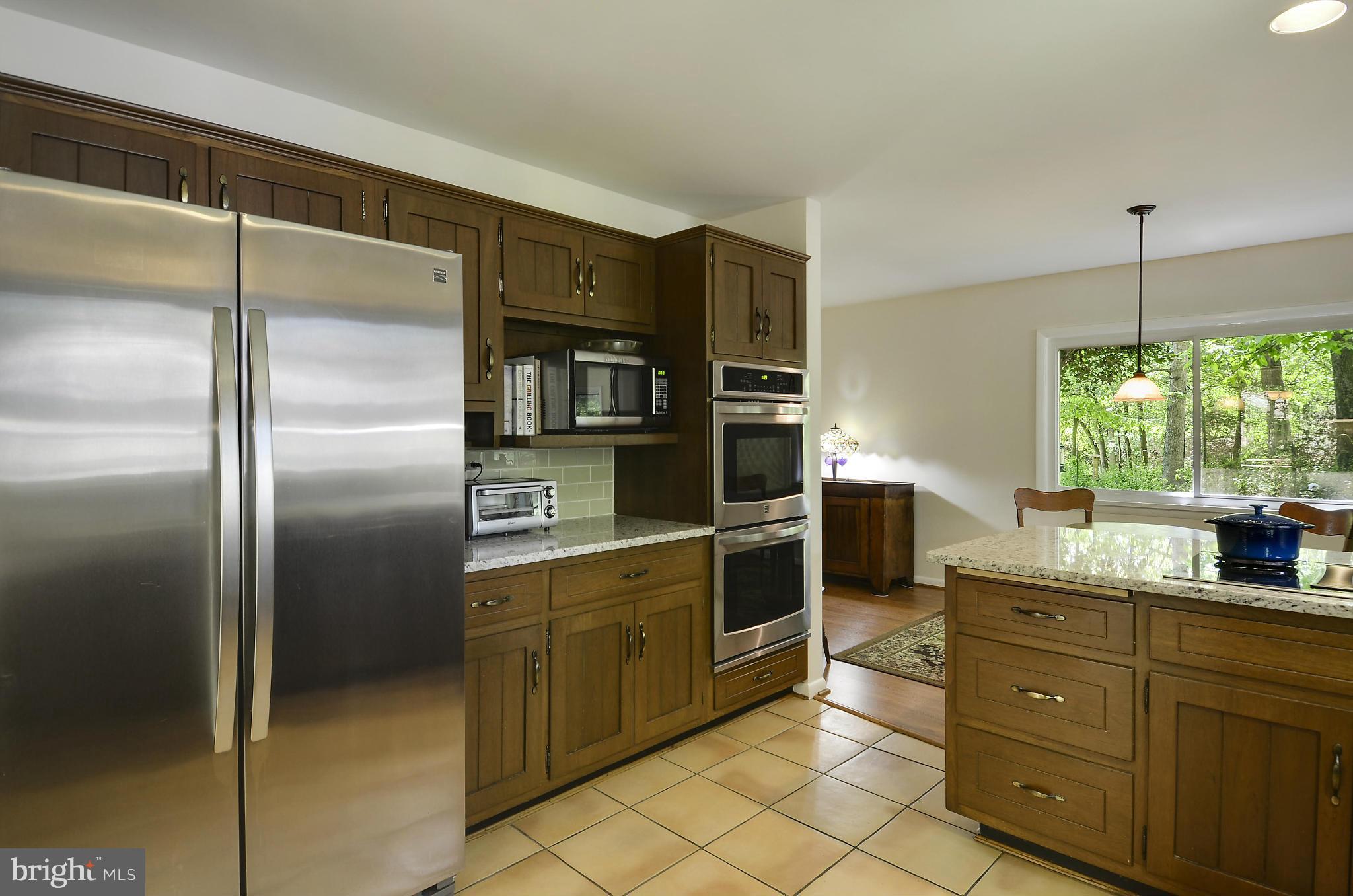 21013 Sunnyacres Road Gaithersburg, MD 20882 - Photo 14 of 30 a kitchen with stainless steel appliances granite countertop a refrigerator and a sink
