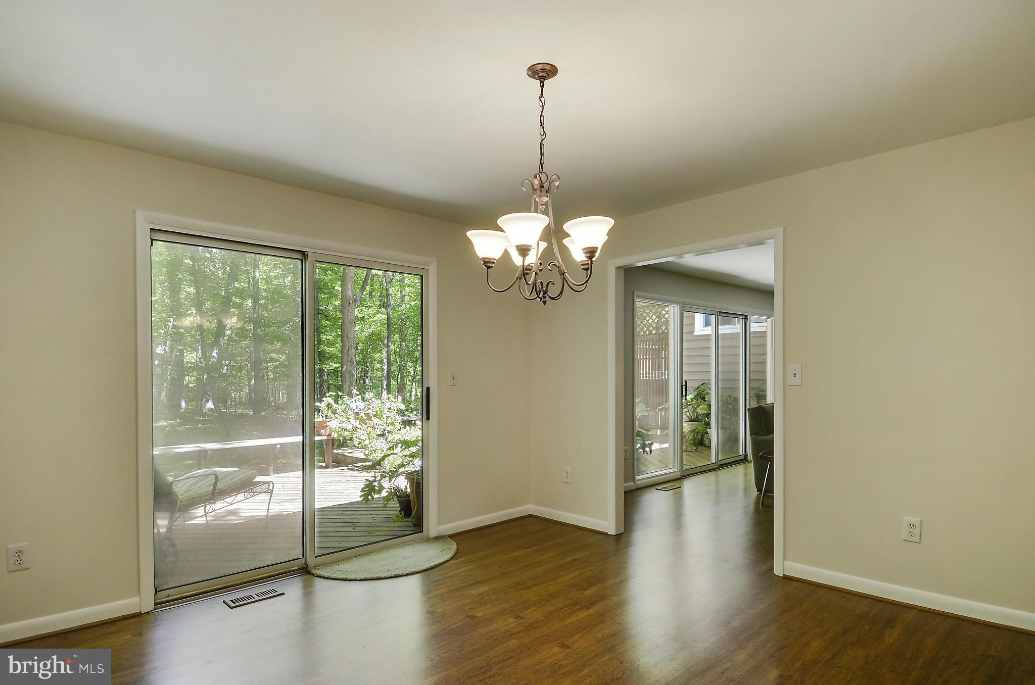 21013 Sunnyacres Road Gaithersburg, MD 20882 - Photo 15 of 30 a view of a room with wooden floor chandelier and windows