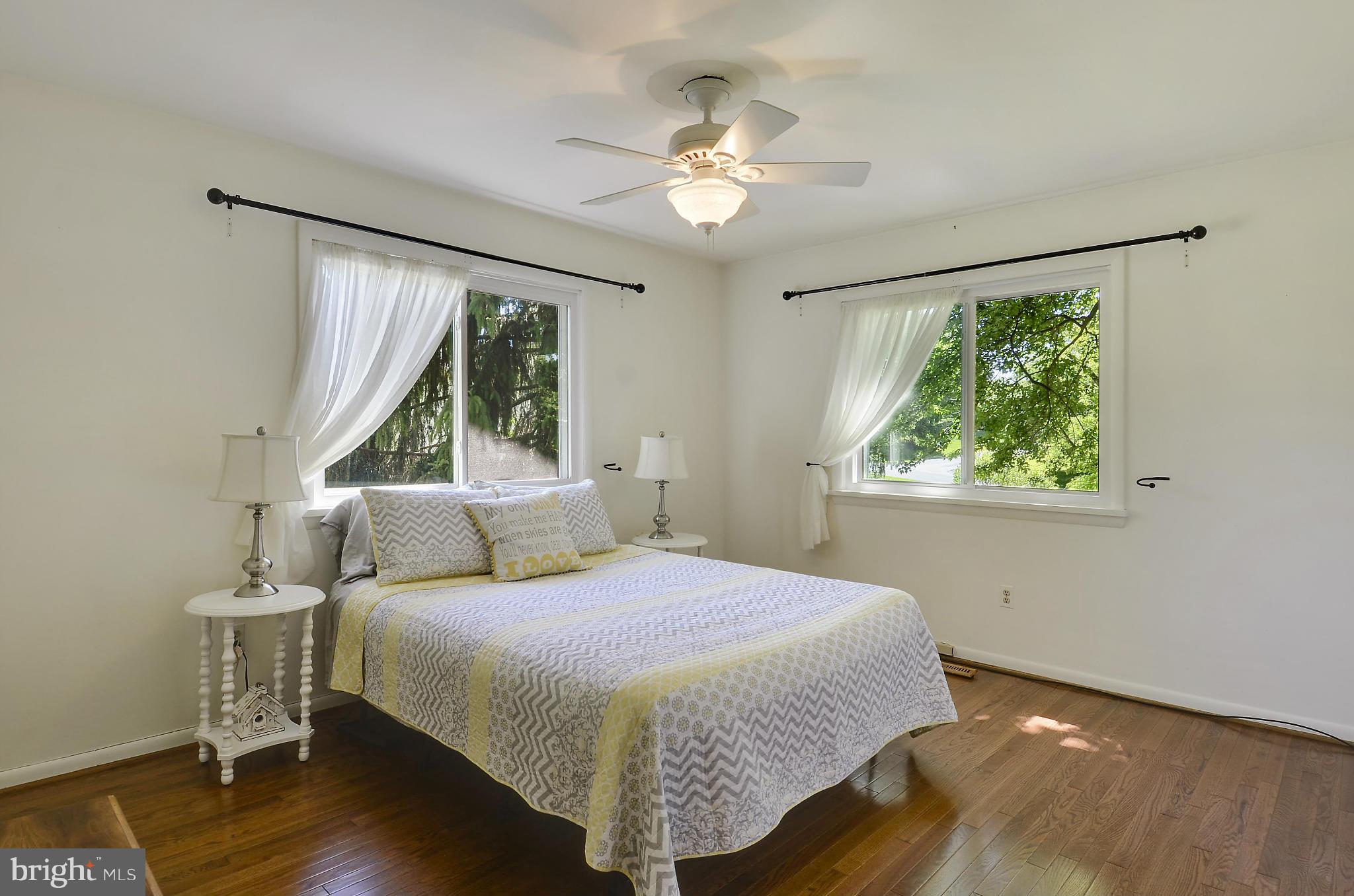 21013 Sunnyacres Road Gaithersburg, MD 20882 - Photo 20 of 30 a bedroom with a large bed and a window