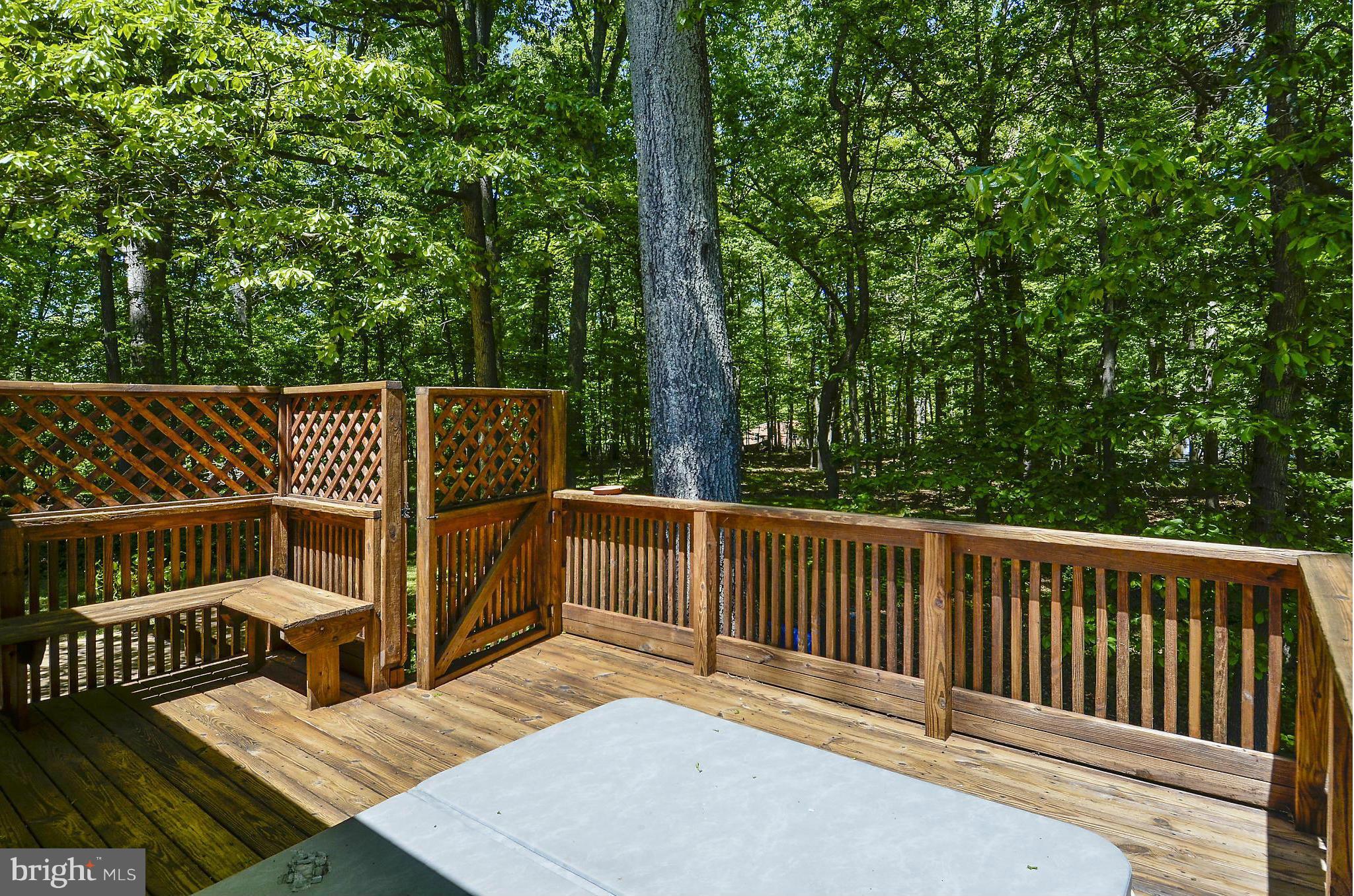 21013 Sunnyacres Road Gaithersburg, MD 20882 - Photo 26 of 30 a view of balcony with wooden floor and fence
