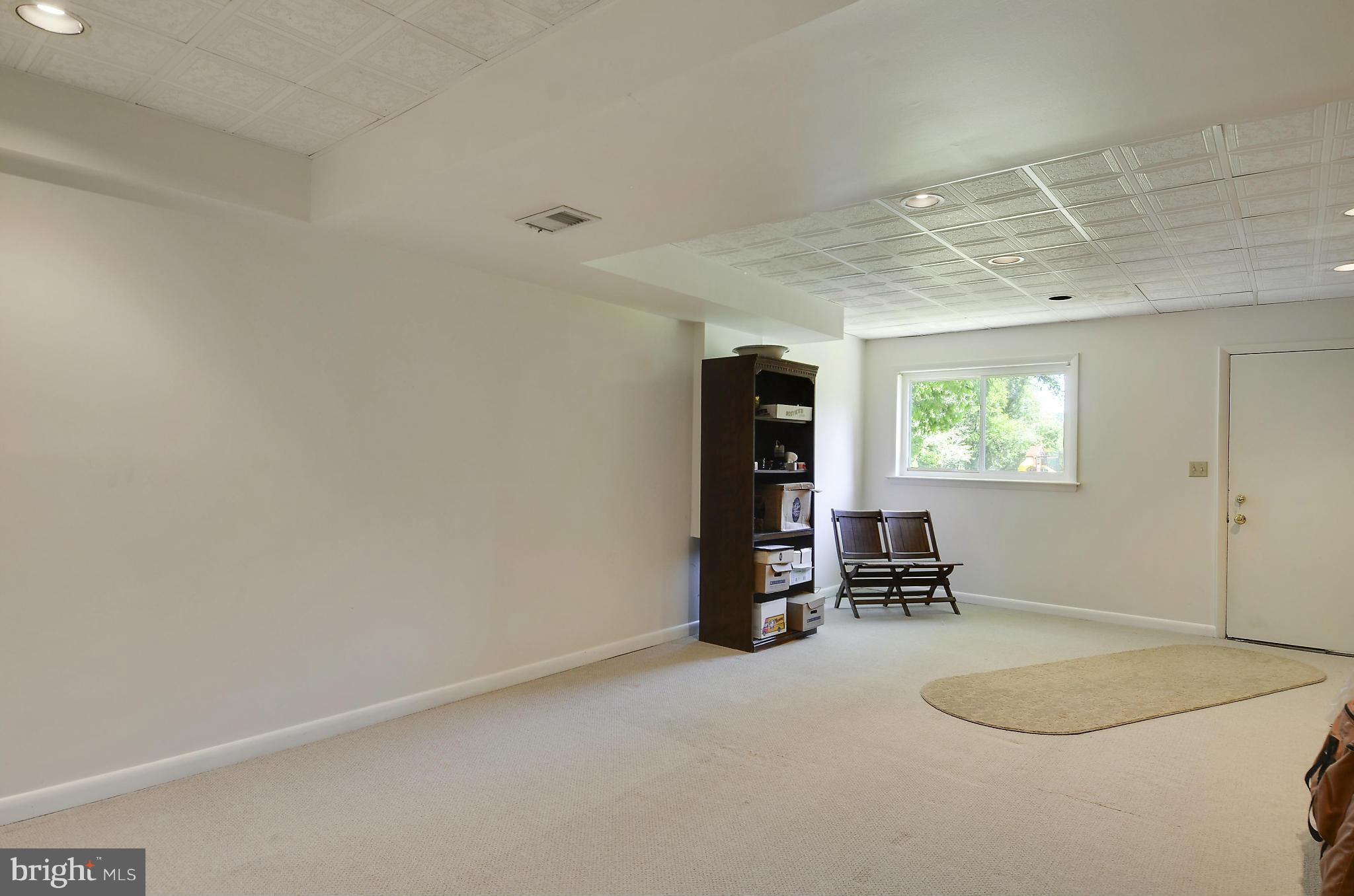 21013 Sunnyacres Road Gaithersburg, MD 20882 - Photo 27 of 30 an empty room with furniture and window