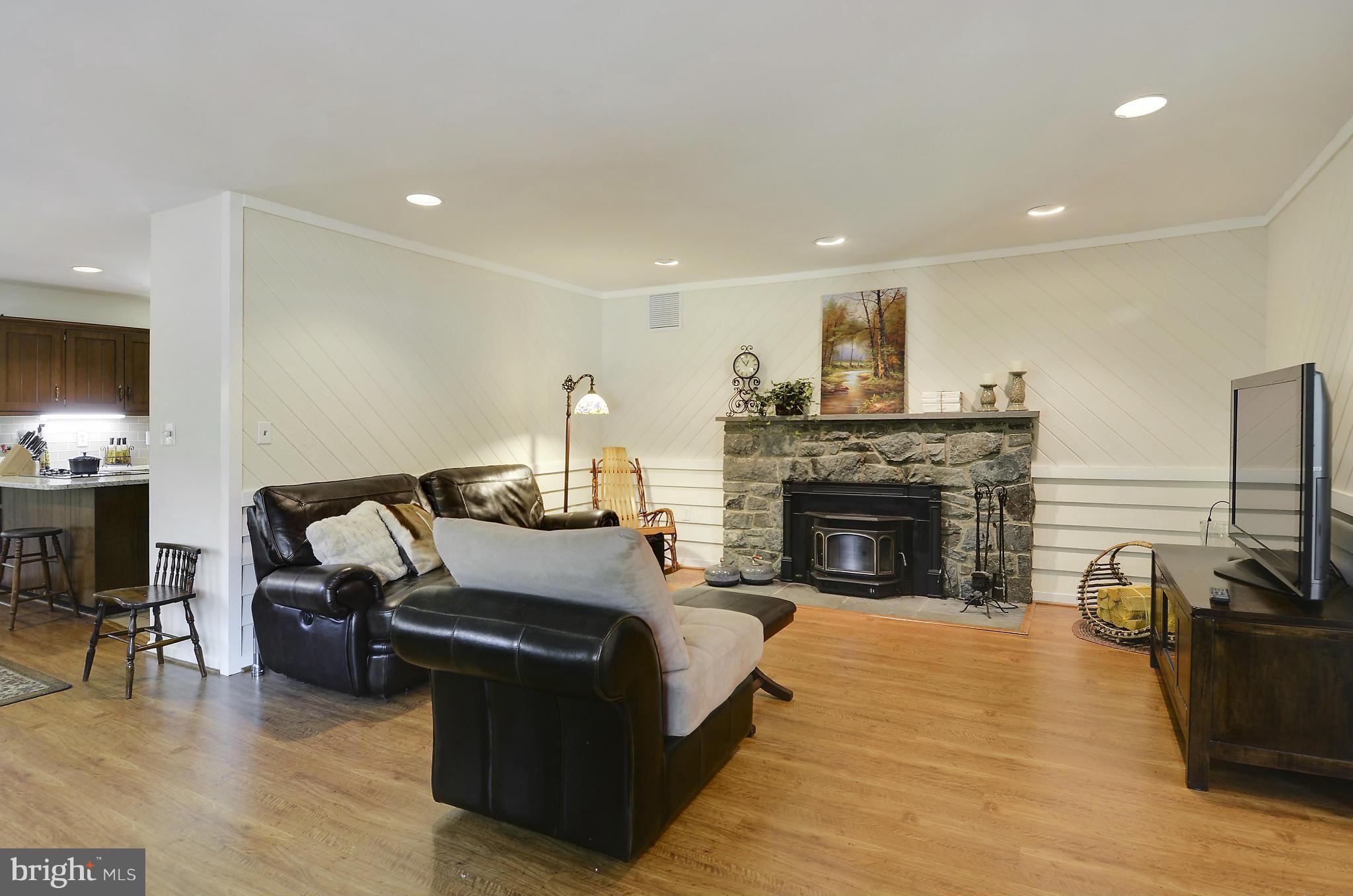 21013 Sunnyacres Road Gaithersburg, MD 20882 - Photo 10 of 30 a living room with furniture and a fireplace