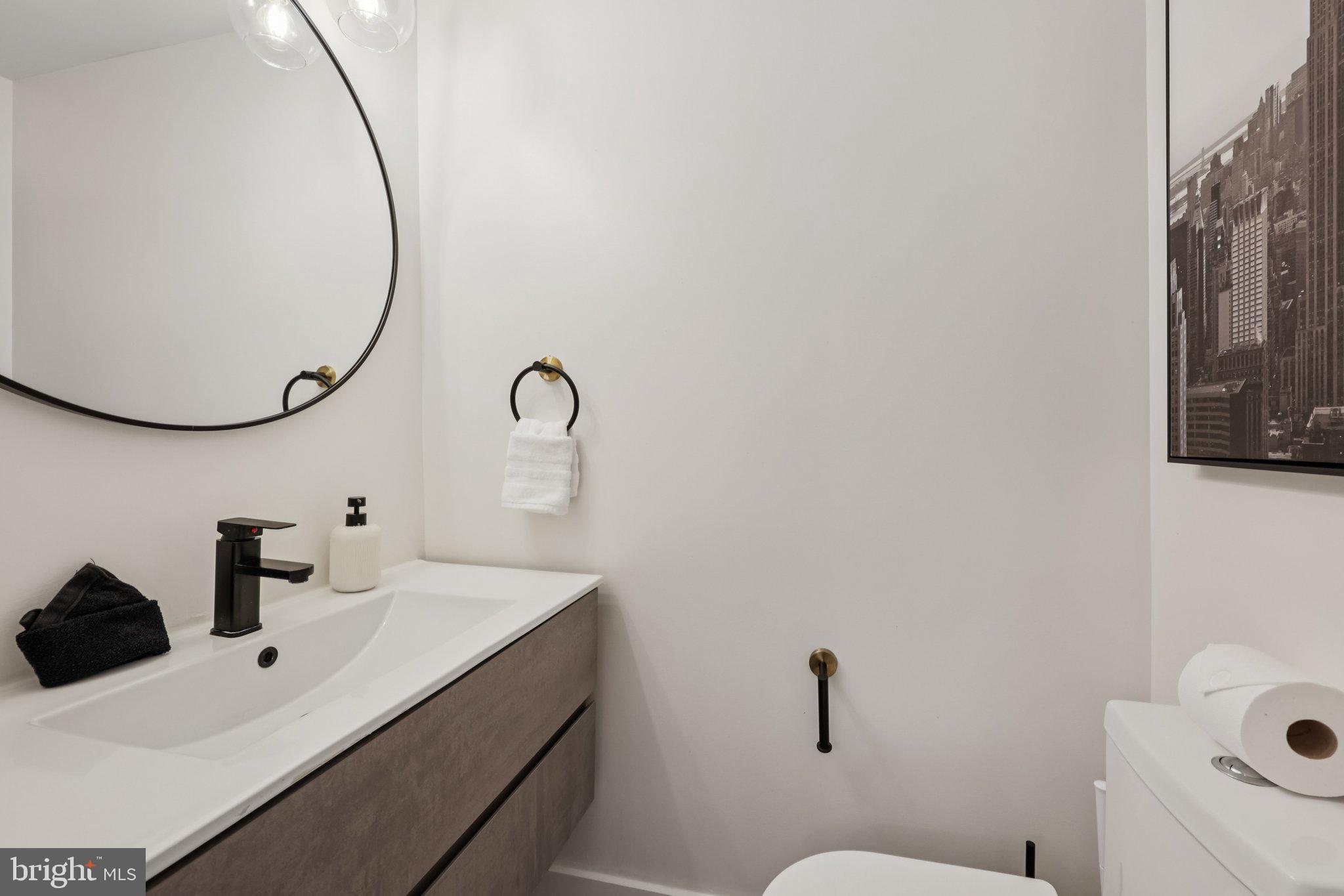 2604 4th Street Northeast Washington, DC 20002 - Photo 17 of 41 a bathroom with a sink and a mirror
