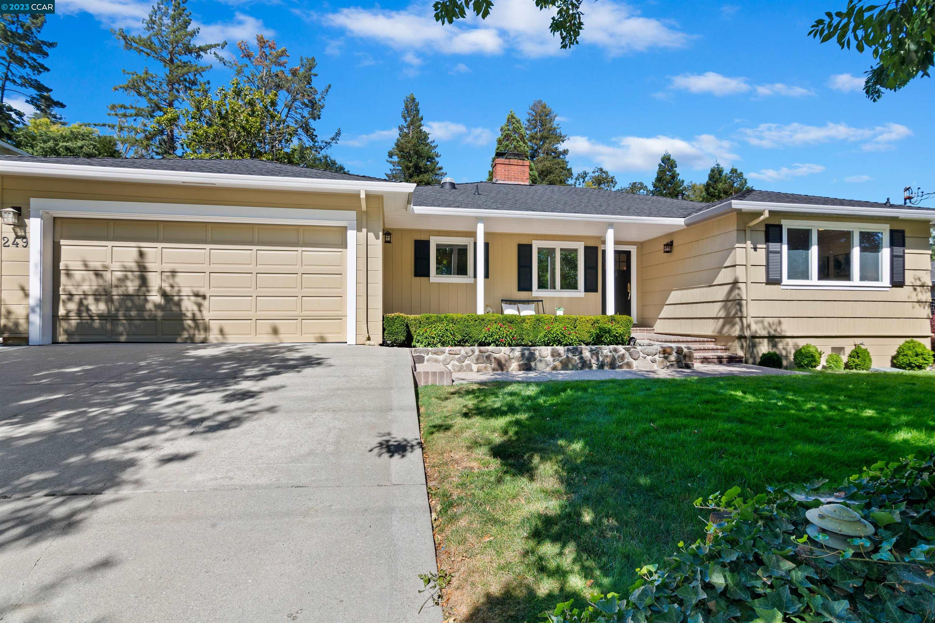 front view of a house with a yard