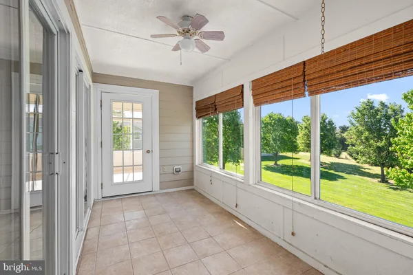 a view of a room with a large window