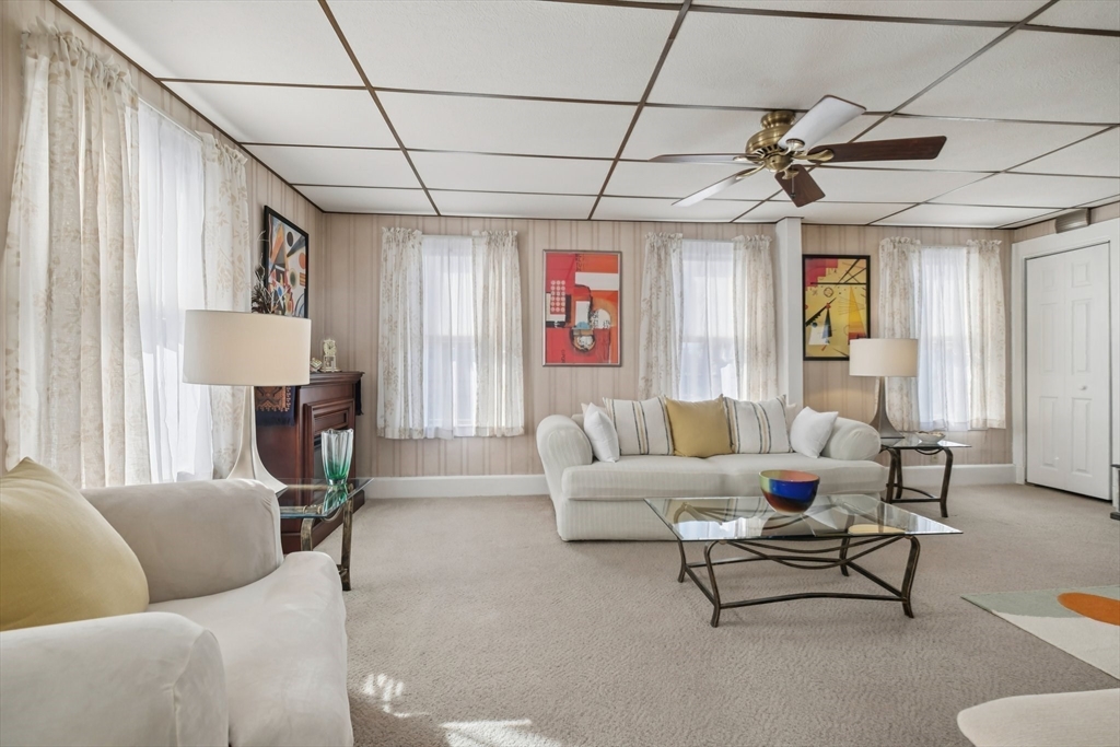 39-41 Kinsman Street Everett, MA 02149 - Photo 12 of 37 a living room with furniture and a window