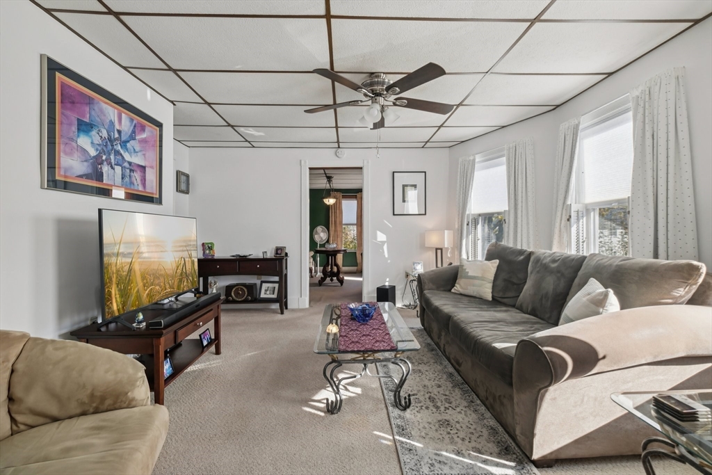 39-41 Kinsman Street Everett, MA 02149 - Photo 13 of 37 a living room with furniture and a flat screen tv