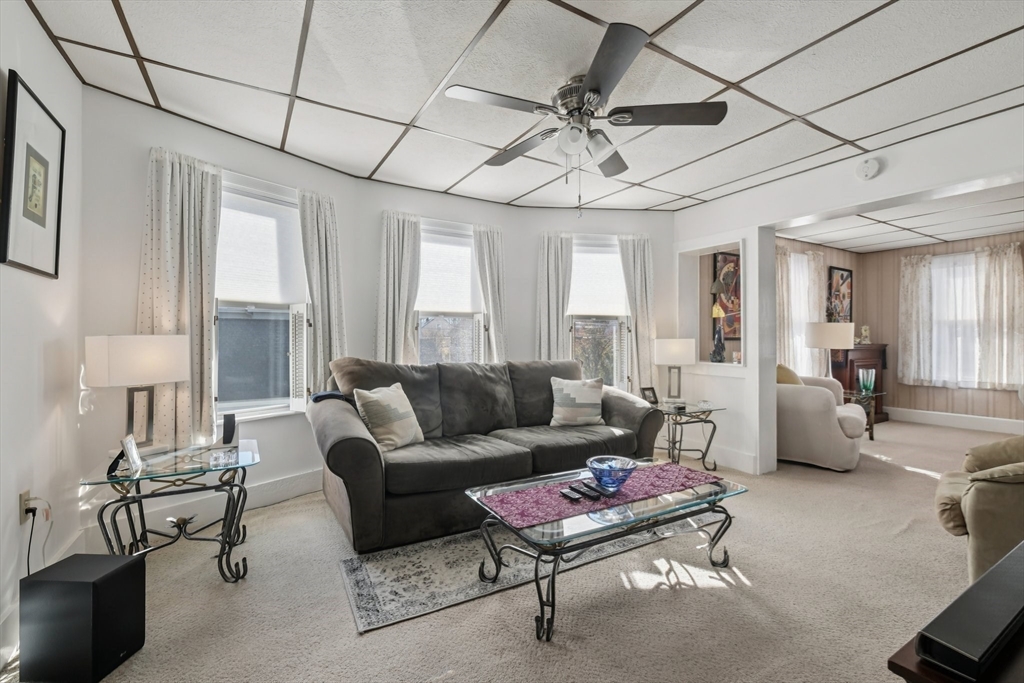 39-41 Kinsman Street Everett, MA 02149 - Photo 14 of 37 a living room with furniture a ceiling fan and a window
