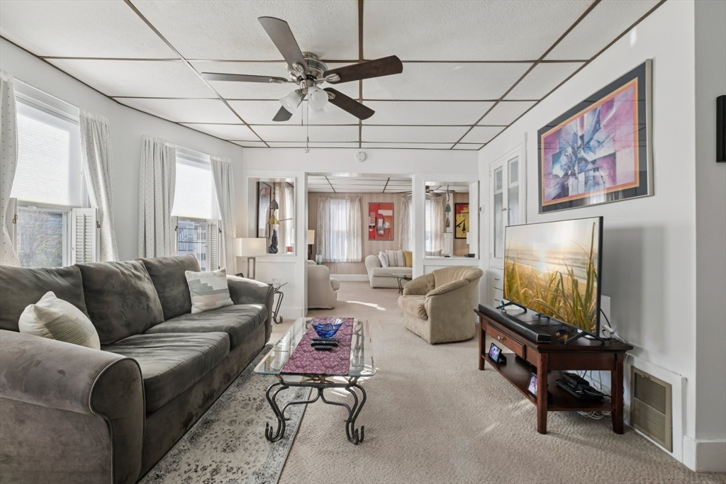 39-41 Kinsman Street Everett, MA 02149 - Photo 15 of 37 a living room with furniture and a flat screen tv