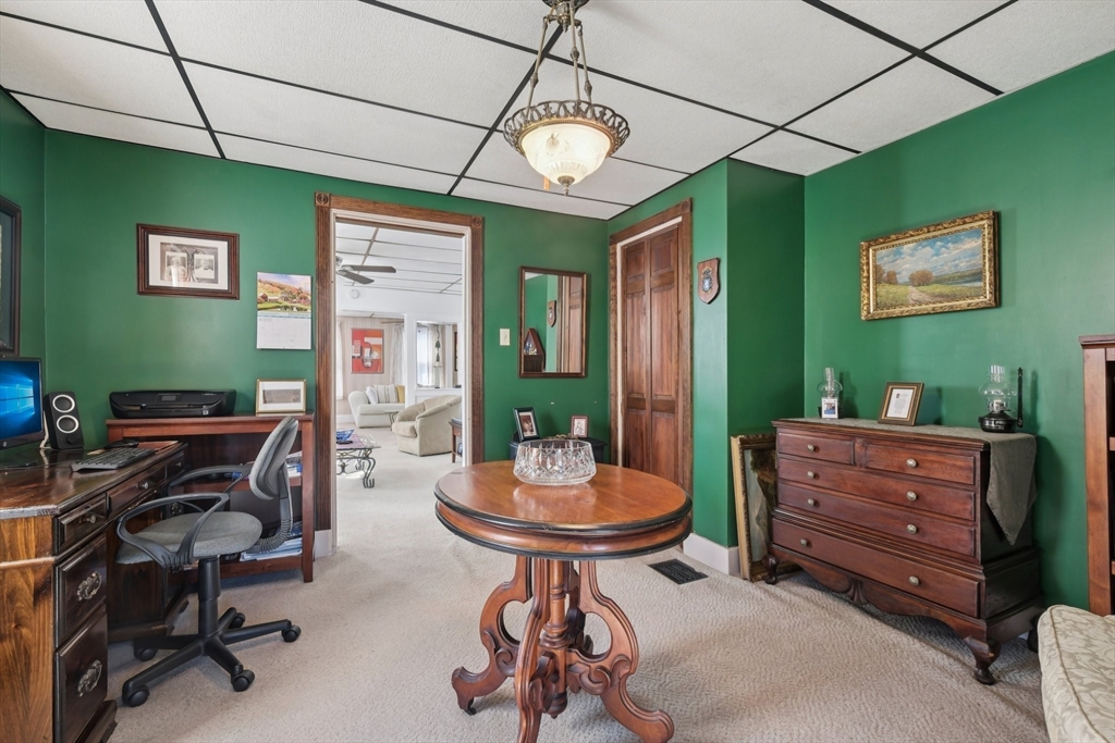39-41 Kinsman Street Everett, MA 02149 - Photo 18 of 37 a room with furniture a piano and a window