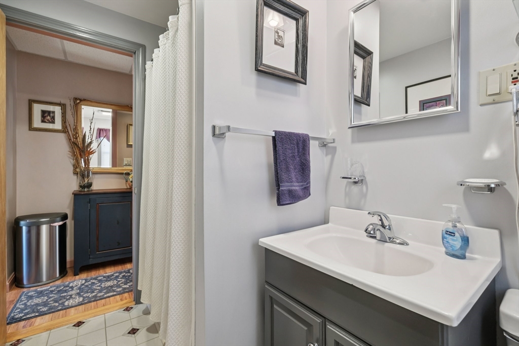 39-41 Kinsman Street Everett, MA 02149 - Photo 19 of 37 a bathroom with a sink and a mirror