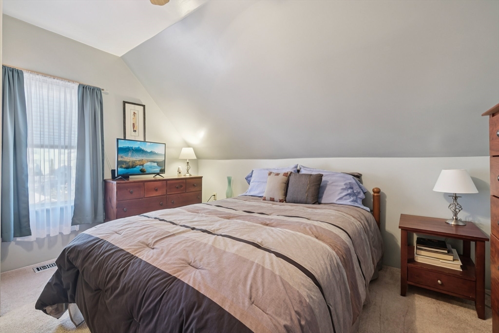 39-41 Kinsman Street Everett, MA 02149 - Photo 22 of 37 a bedroom with a bed and a window