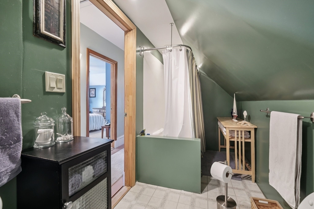 39-41 Kinsman Street Everett, MA 02149 - Photo 23 of 37 a bathroom with a sink a mirror and a shower