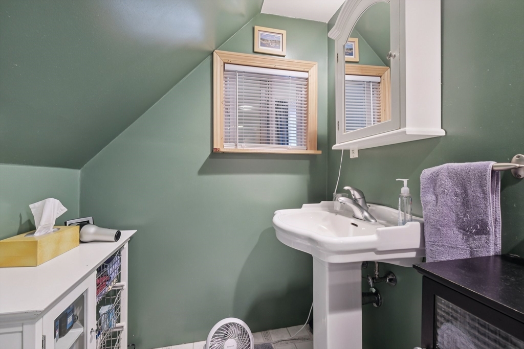39-41 Kinsman Street Everett, MA 02149 - Photo 24 of 37 a bathroom with a sink and a mirror