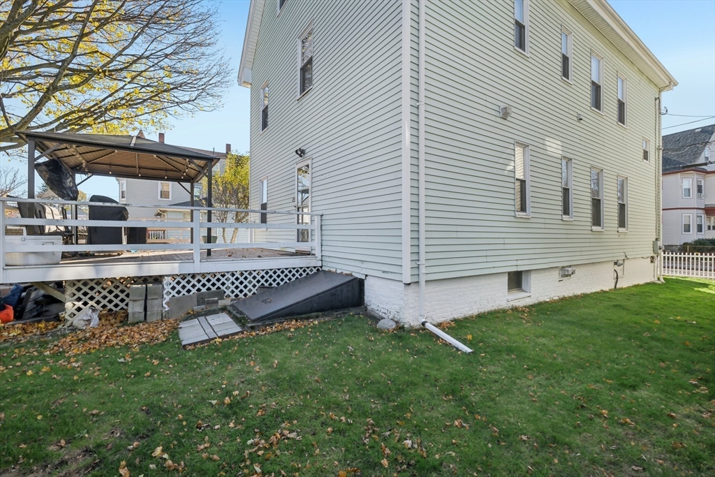 39-41 Kinsman Street Everett, MA 02149 - Photo 32 of 37 a front view of a house with garden