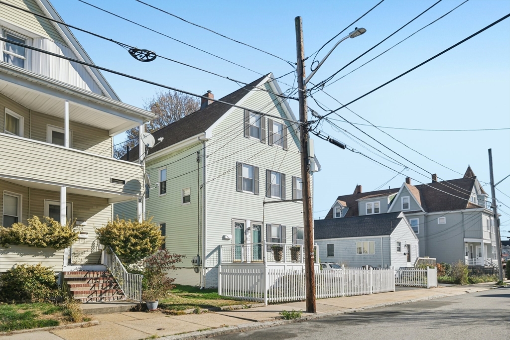 39-41 Kinsman Street Everett, MA 02149 - Photo 4 of 37 a front view of a house with garden