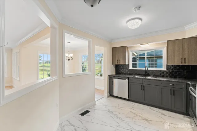 an empty room with fan and windows