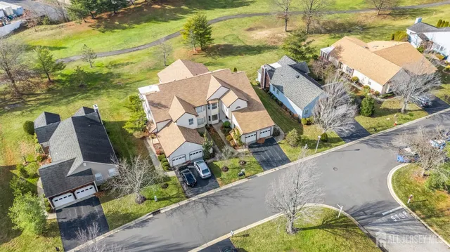 an aerial view of a house with yard swimming pool and outdoor seating