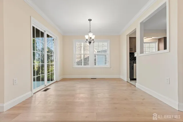 a kitchen with granite countertop a refrigerator and a stove top oven