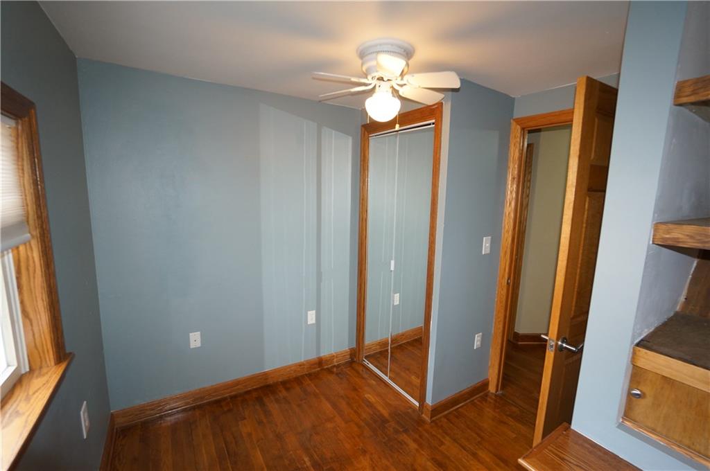 890 Middle Road Castle Shannon, PA 15234 - Photo 20 of 25 Bedroom three is a bit petite but every inch is thoroughly used from the storage shelfing...OAK hardwood floors