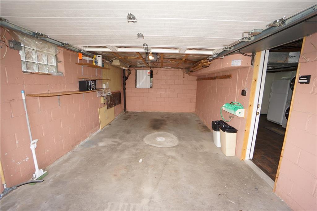 890 Middle Road Castle Shannon, PA 15234 - Photo 23 of 25 one car garage is extra deep & has newer insulated garage door w/exterior key pad, note glass block windws