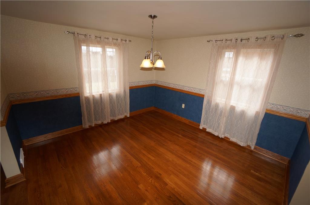 890 Middle Road Castle Shannon, PA 15234 - Photo 5 of 25 Dining room w oak chair rail, trim & floors...beautiful Anderson windows...