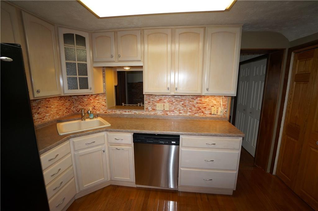 890 Middle Road Castle Shannon, PA 15234 - Photo 6 of 25 High End Quality Merrillatt cabinetry...pull out for trash & pull down bin for brillo pads & sponges