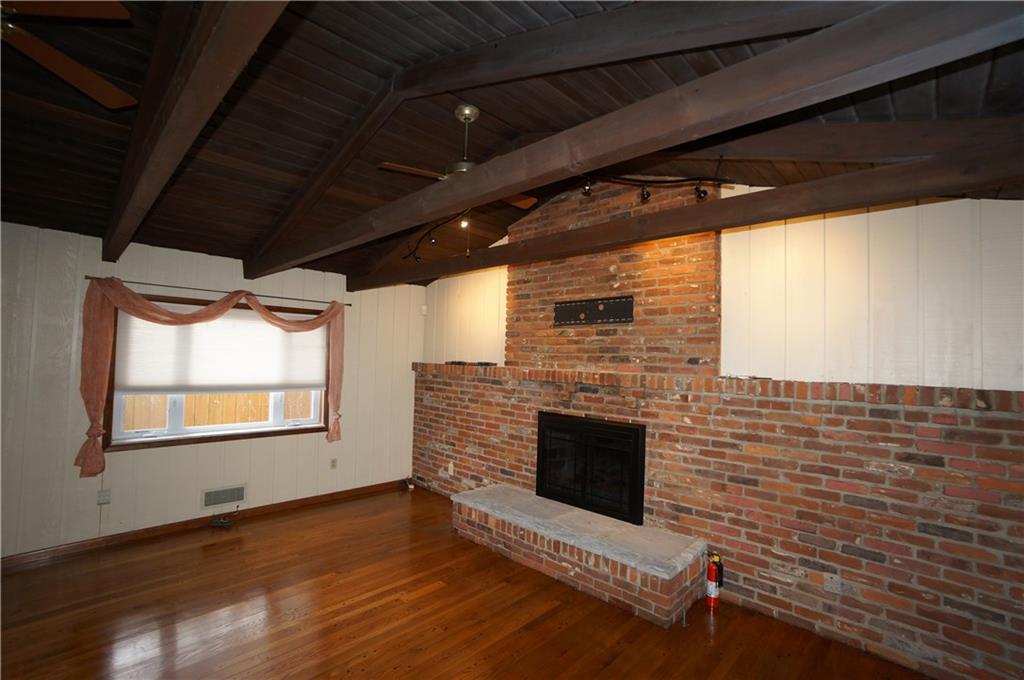 890 Middle Road Castle Shannon, PA 15234 - Photo 10 of 25 Rustic gas burning FP w raised hearth and impressive wood ceiling and beams...has a feeling of being in the mountains...