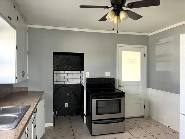 a kitchen with a stove and a refrigerator