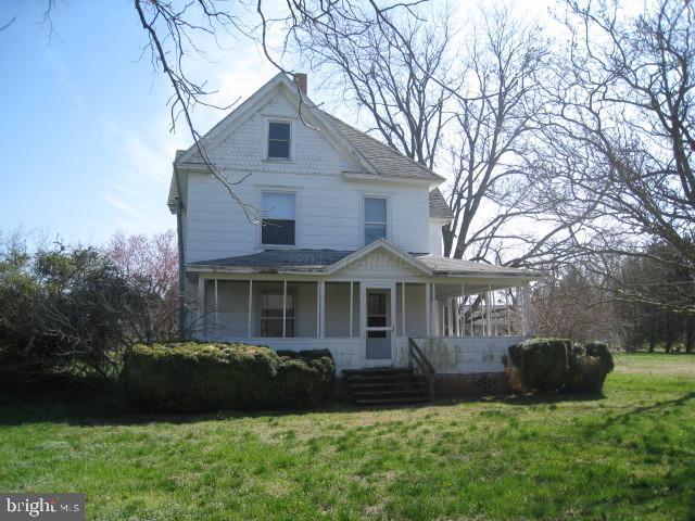 5905 Coventry Parish Road Westover, MD 21871 - Photo 1 of 9 a front view of a house with a garden and yard