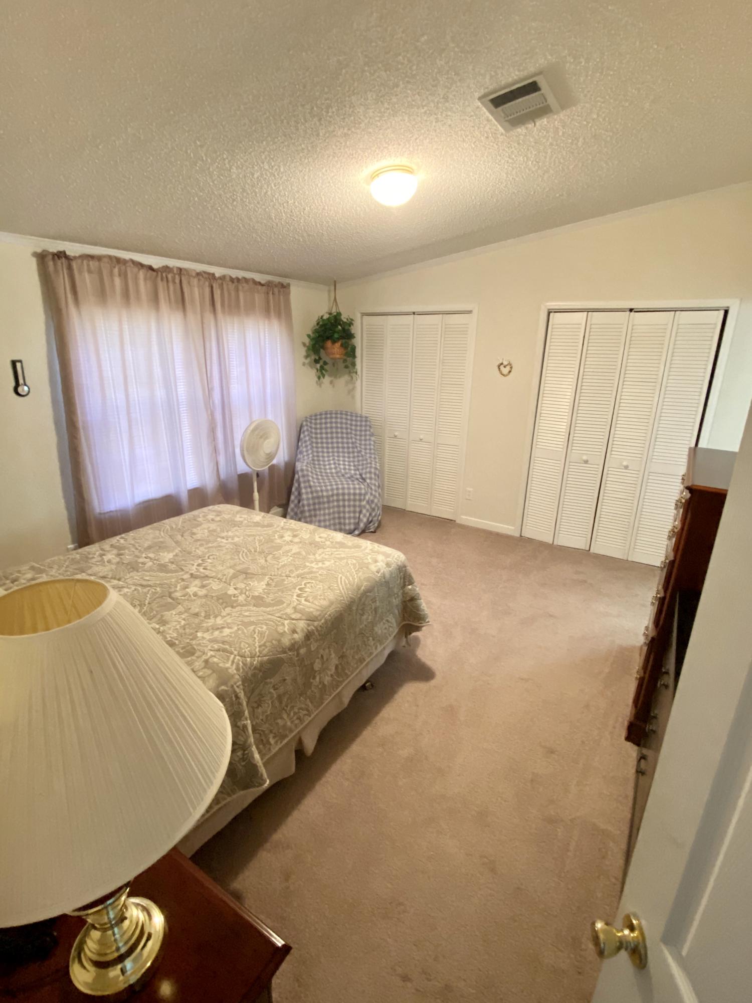 199 South 2nd Street Santa Rosa Beach, FL 32459 - Photo 8 of 14 a bedroom with a bed and a window