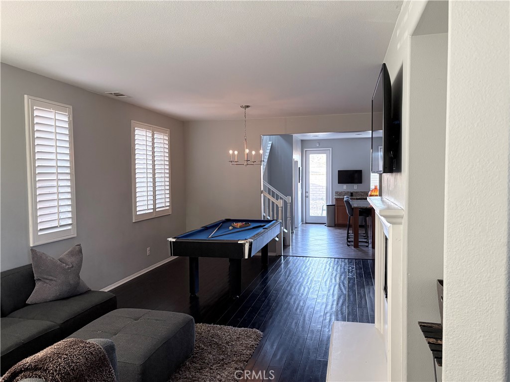 2729 Hornbeam Road Palmdale, CA 93551 - Photo 23 of 35 a living room with furniture and a wooden floor