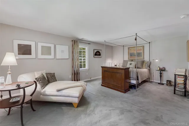 a bedroom with bed and a couch