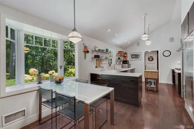 a view of a dining room with furniture window and outside view
