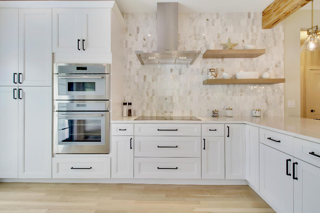 623 Avon Road West Palm Beach, FL 33401 - Photo 11 of 39 a kitchen with stainless steel appliances cabinets and a window