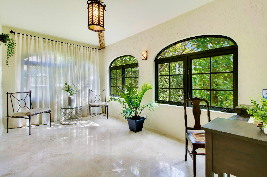 623 Avon Road West Palm Beach, FL 33401 - Photo 16 of 39 a living room filled with furniture and a potted plant