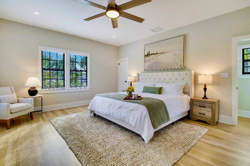 623 Avon Road West Palm Beach, FL 33401 - Photo 22 of 39 a bedroom with a large bed and a couch