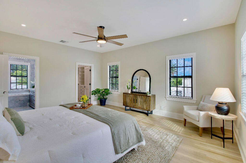 623 Avon Road West Palm Beach, FL 33401 - Photo 23 of 39 a bedroom with a bed wooden floor and a window