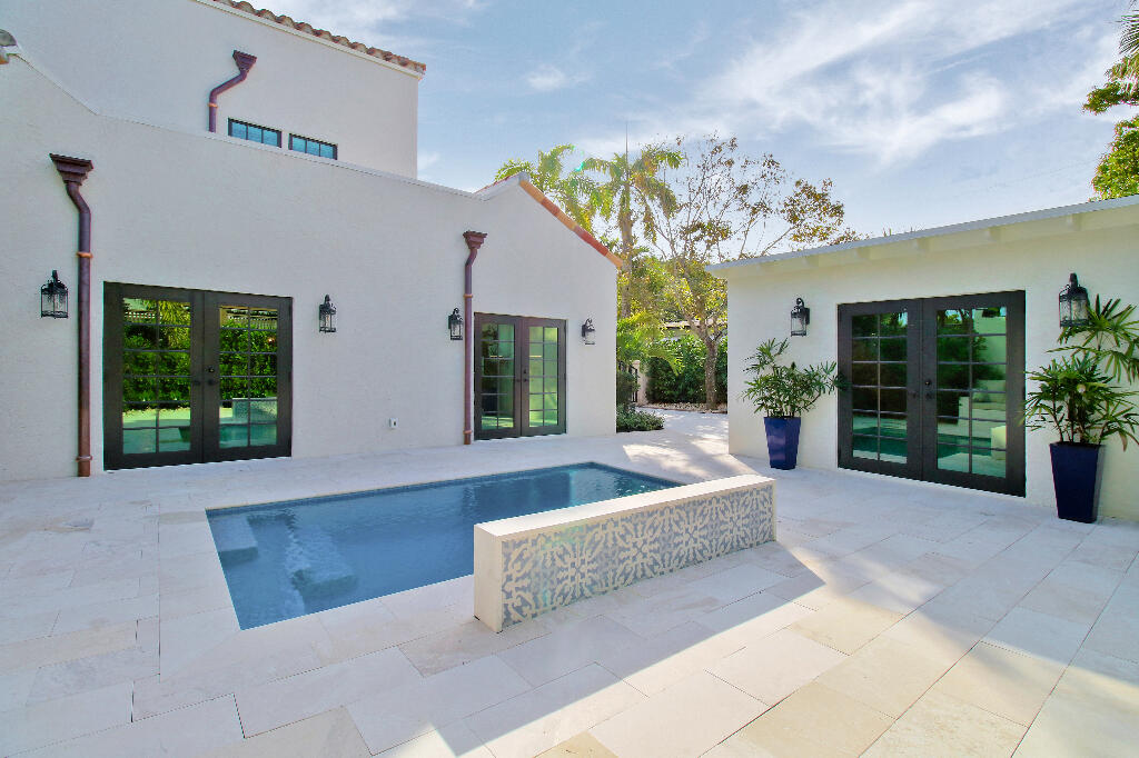 623 Avon Road West Palm Beach, FL 33401 - Photo 30 of 39 a view of a house with swimming pool and sitting area