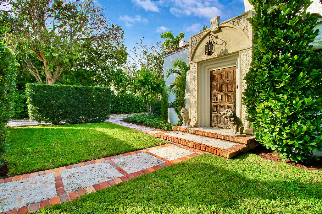 623 Avon Road West Palm Beach, FL 33401 - Photo 3 of 39 a front view of a house with garden