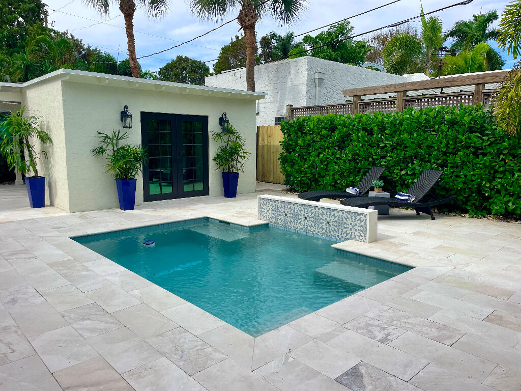 623 Avon Road West Palm Beach, FL 33401 - Photo 31 of 39 a swimming pool with outdoor seating and yard