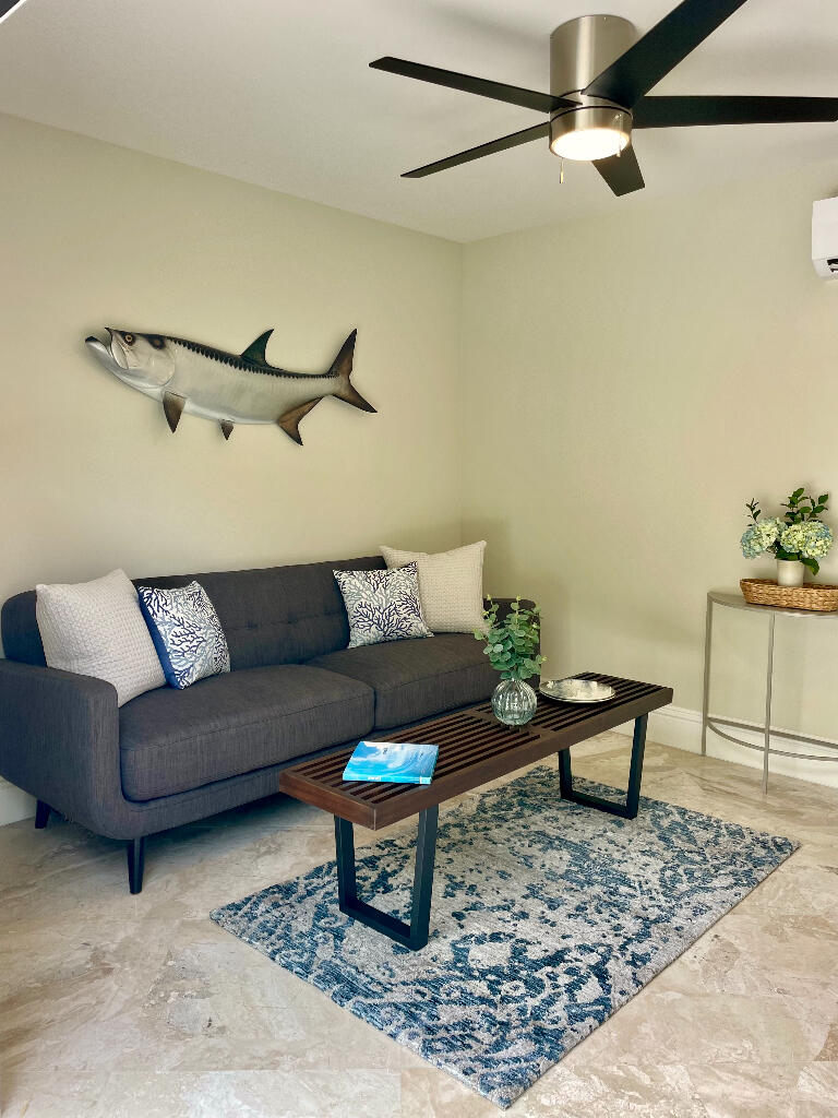 623 Avon Road West Palm Beach, FL 33401 - Photo 32 of 39 a living room with furniture and a rug