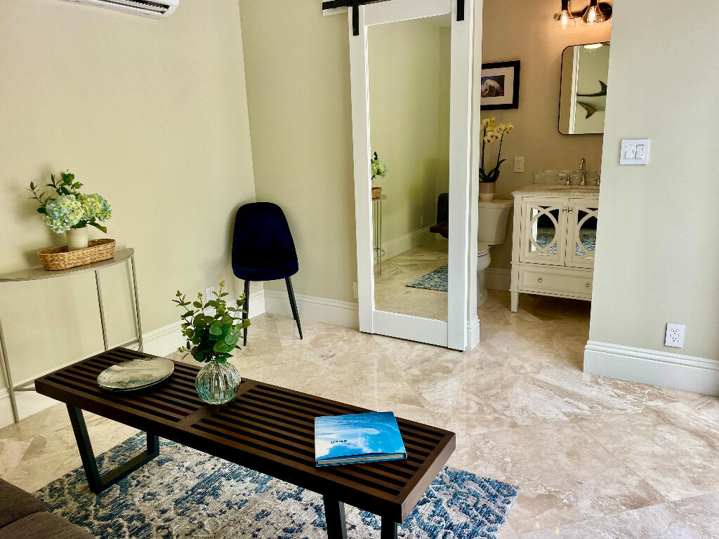 623 Avon Road West Palm Beach, FL 33401 - Photo 33 of 39 a living room with furniture and a rug