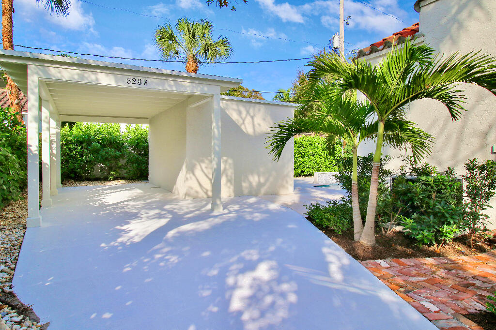 623 Avon Road West Palm Beach, FL 33401 - Photo 37 of 39 a view of a yard with plants and a bench