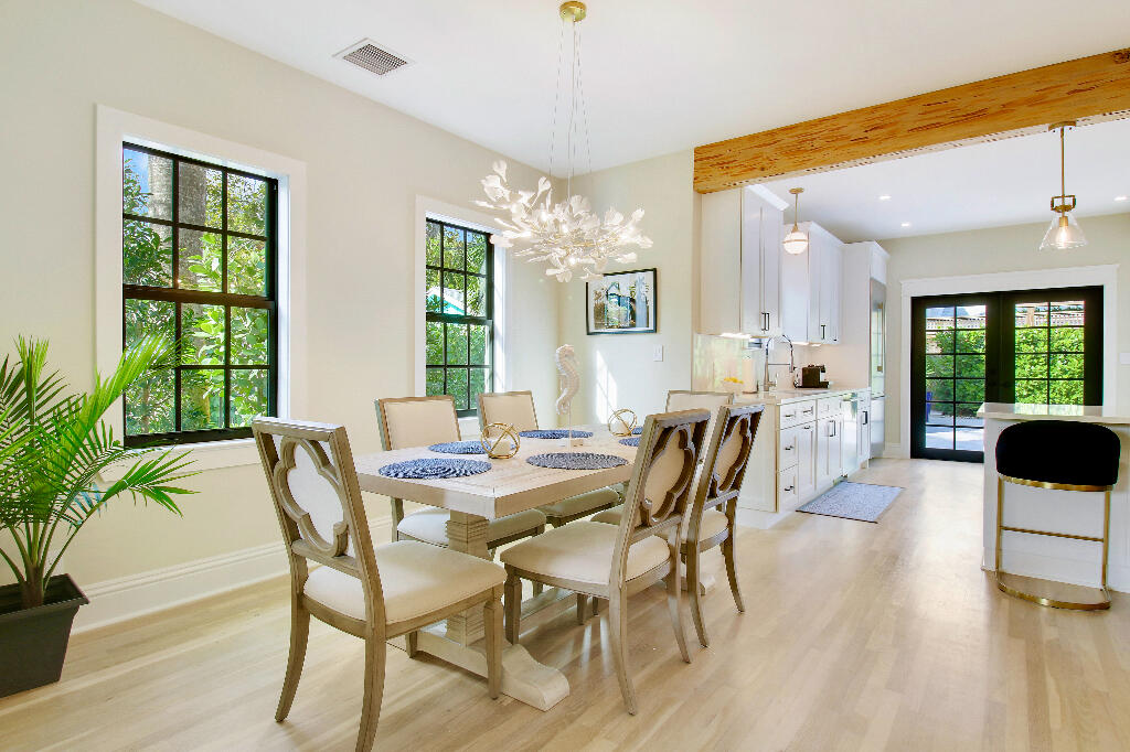 623 Avon Road West Palm Beach, FL 33401 - Photo 8 of 39 a view of a dining room with furniture and chandelier